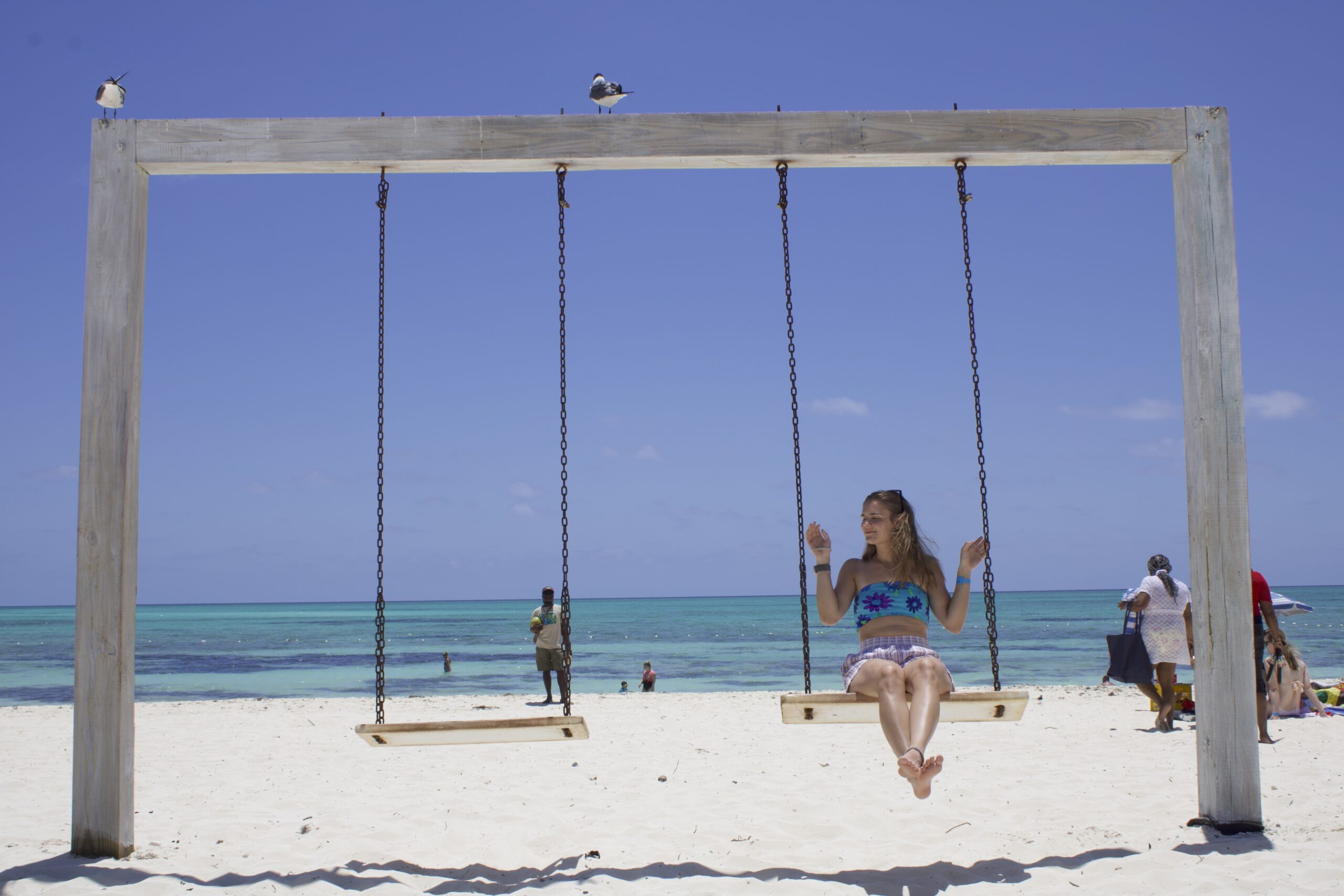 Sam swinging on Fortuna Beach at the Viva Fortuna by Wyndham All Inclusive Resort on Grand Baham Island!