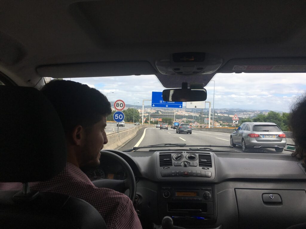 Tour guide driving us to Portugal from Spain